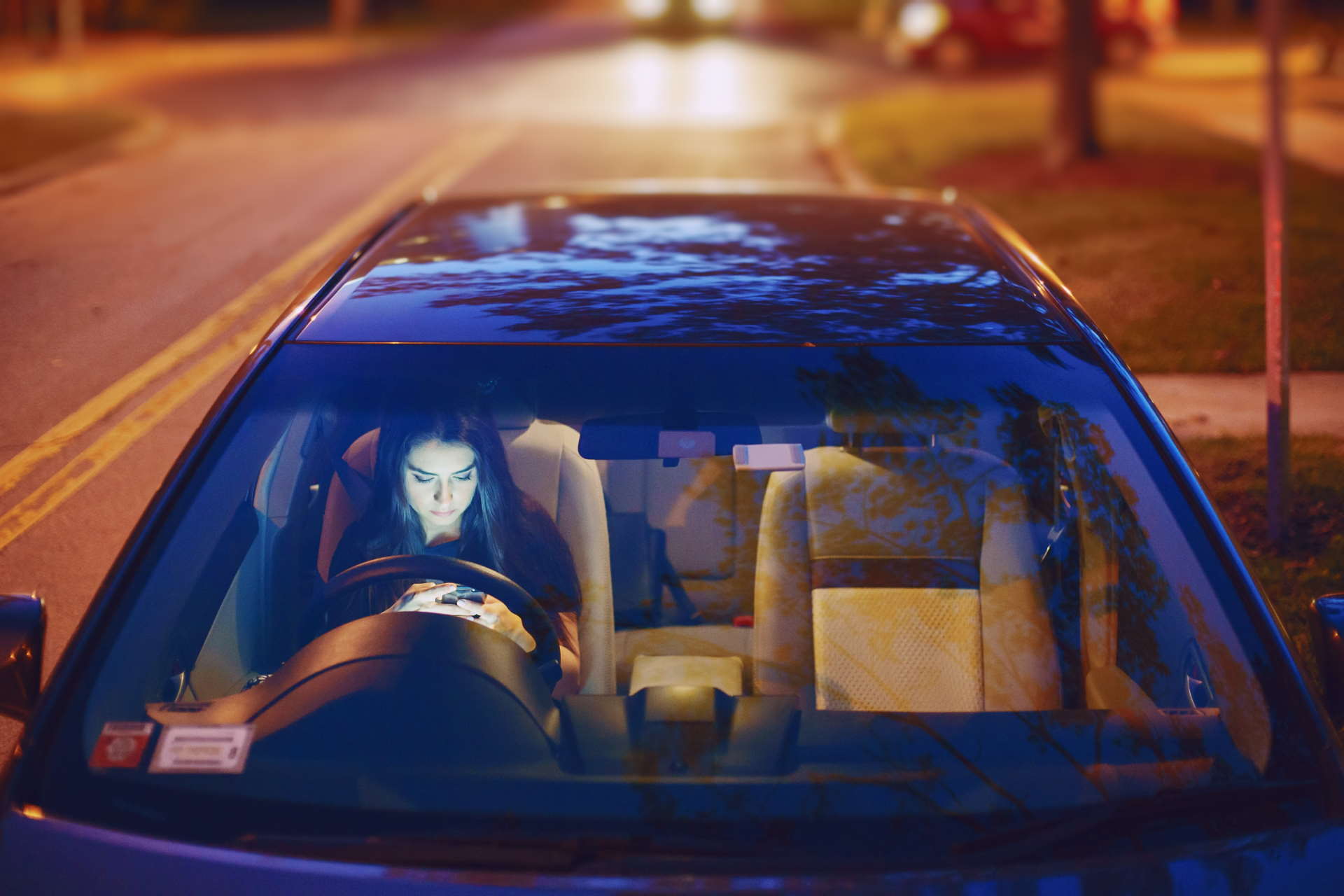 Beautiful Girl Model Sitting In The Car And Use The Phone