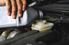 where do you put brake fluid in car