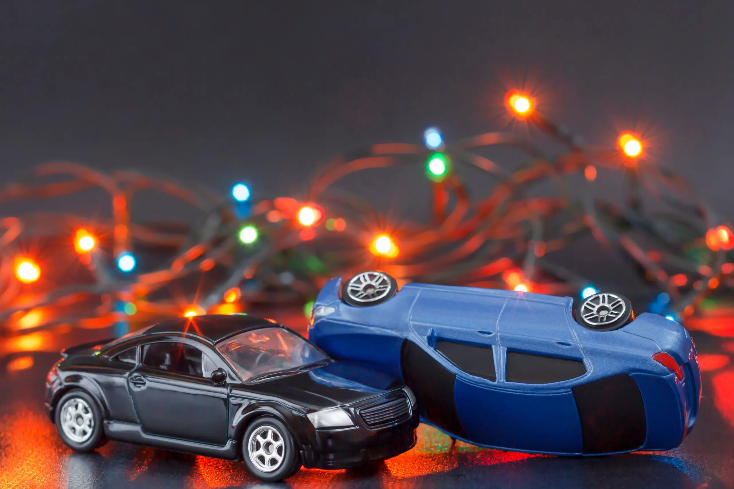 Collision,two,cars,on,christmas,lights,background.,accident,crash,statistics